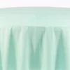 Obrus Mięta Okrągły. Okrągły stół pokryty miętowym obrusem, idealny do dekoracji weselnych i eventowych, prezentuje się elegancko i subtelnie. Pastelowy, delikatny kolor obrusu przyciąga wzrok, dodając uroczystościom świeżości i wiosennej lekkości. Symetrycznie spływające fałdy tkaniny z wysokiej jakości materiału podkreślają luksusową atmosferę każdego przyjęcia. Oferowany przez wypożyczalnię rent4events.pl oraz rent4weddings.pl, ten obrus stanowi idealne rozwiązanie dla organizatorów ślubów i eventów w Wrocławiu, poszukujących wyjątkowych dekoracji - rent4events.pl wypożycz wrażenia, rent4wedding.pl zachowaj wspomnienia.